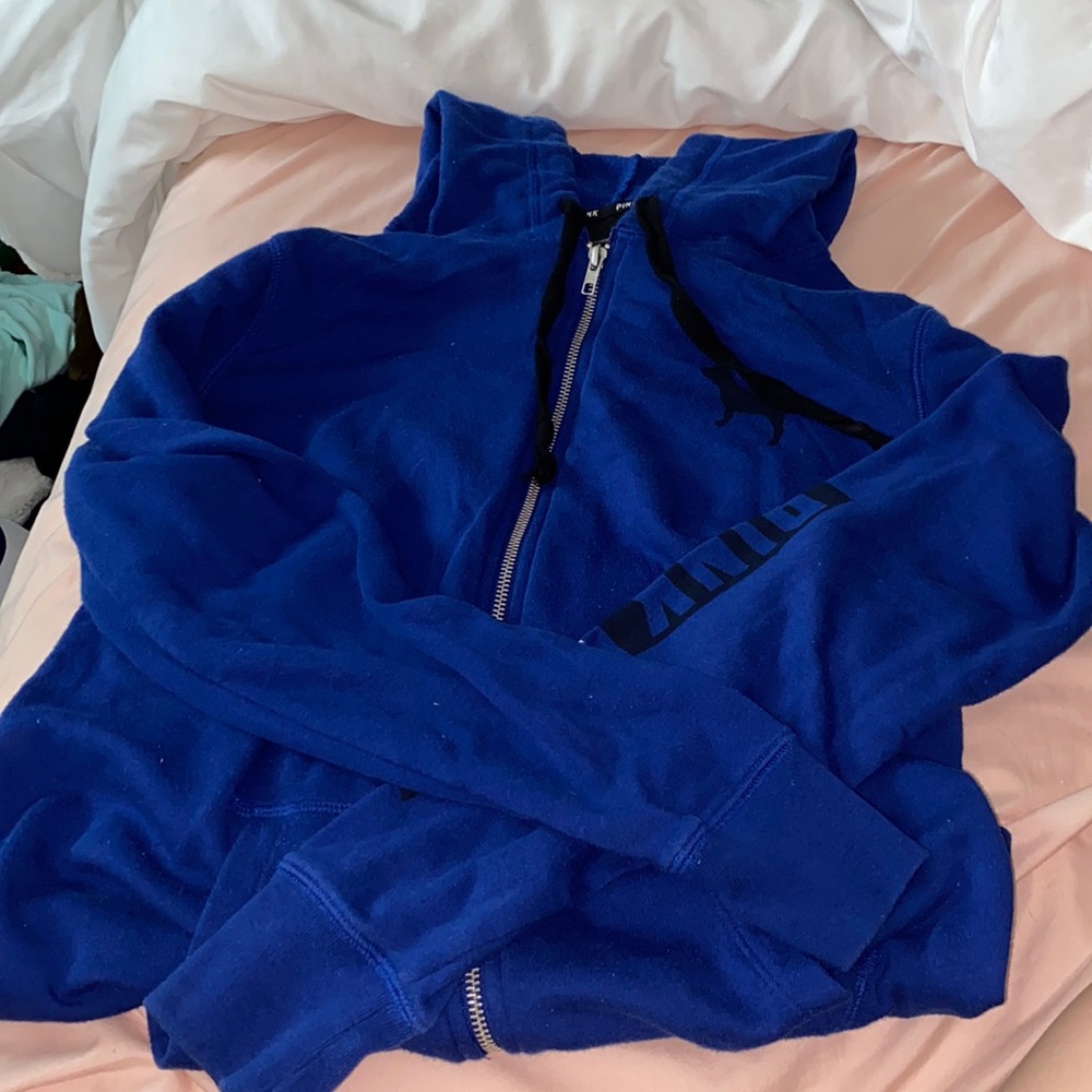 Blue Victoria Secret zipped up sweater.